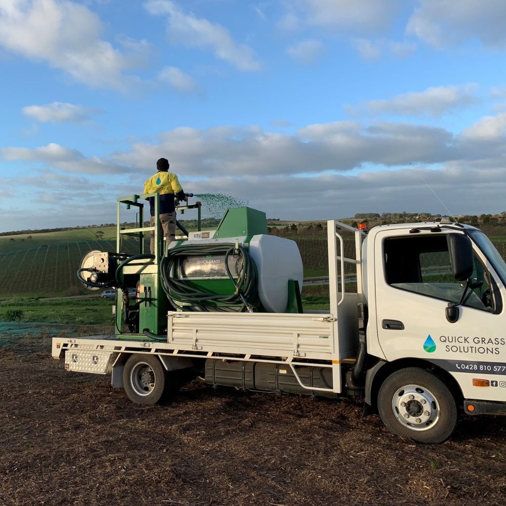 Specialized hydromulching used for erosion control on a dam embankment to prevent soil erosion.